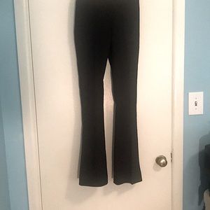 Bebe boot cut pants. Solid black. Stretchable Sz 0